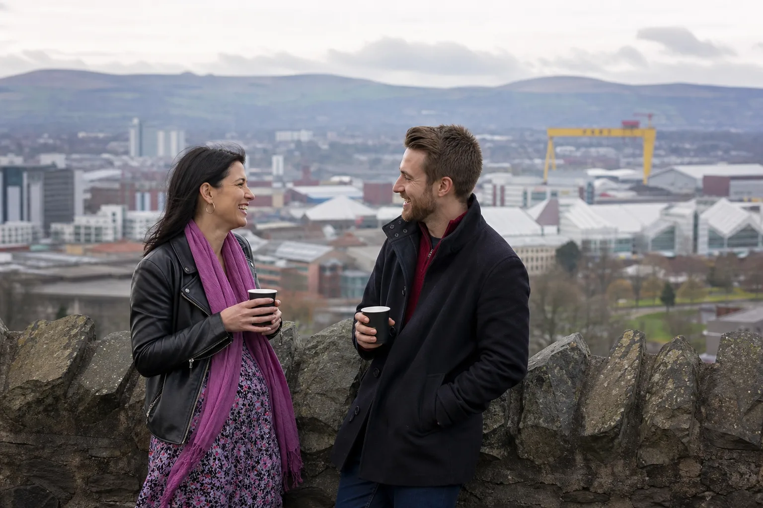 Two people chatting over coffee in Belfast city centre